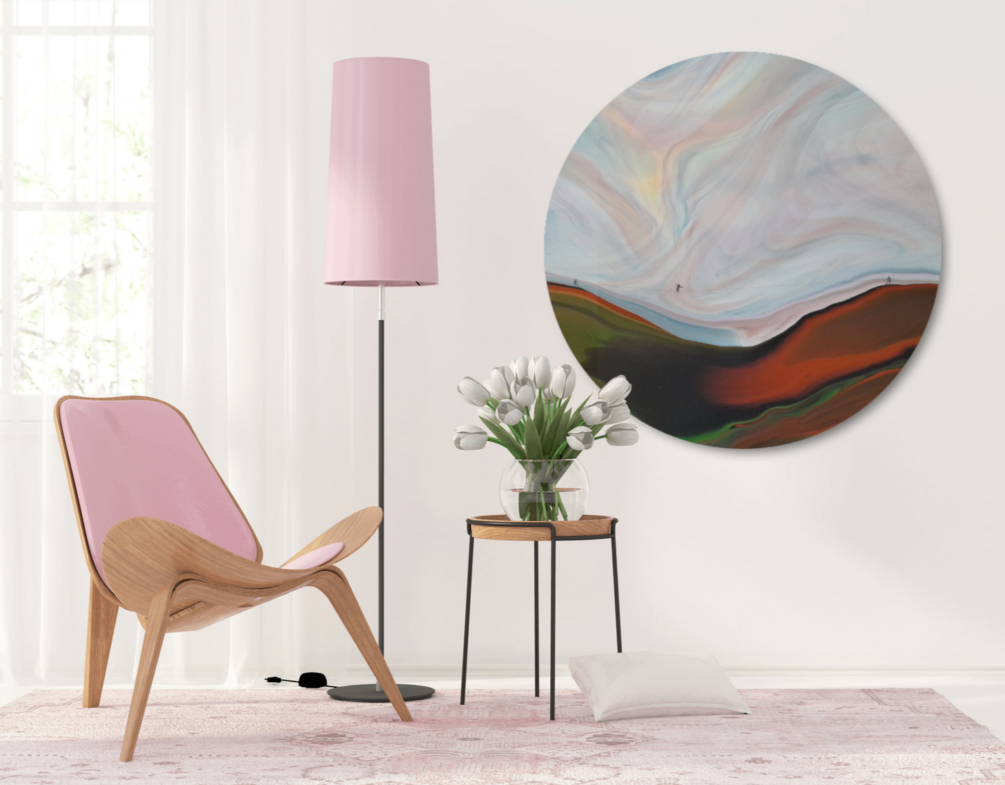 Modern interior with a pink chair, abstract wall art, and a lamp.