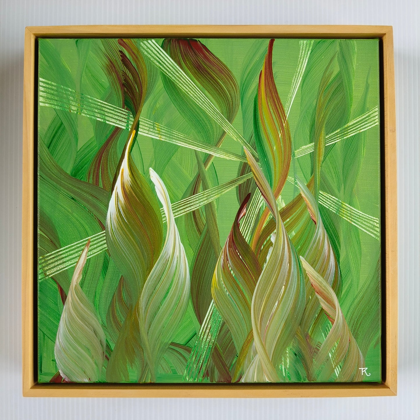 Abstract painting with wavy lines on a green background in a wooden frame.
