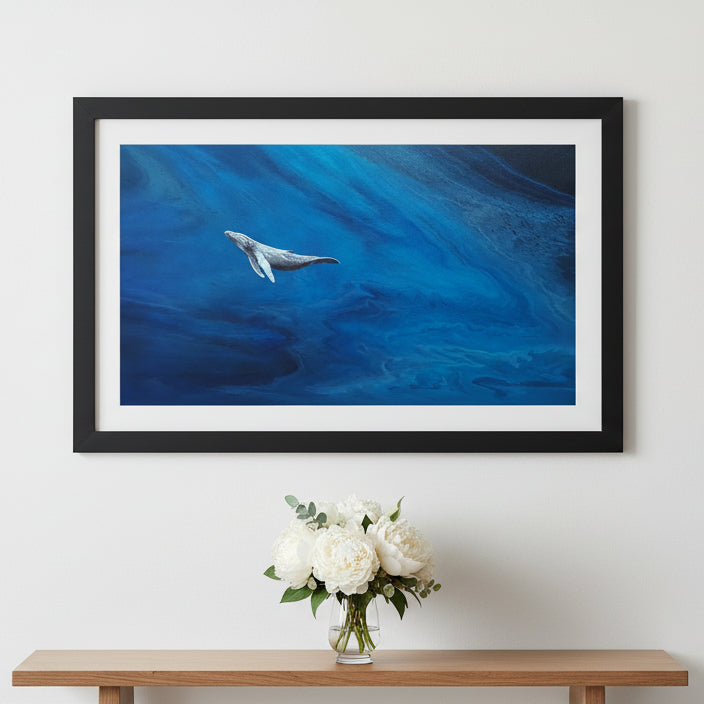 Humpback whale in the ocean with blue water