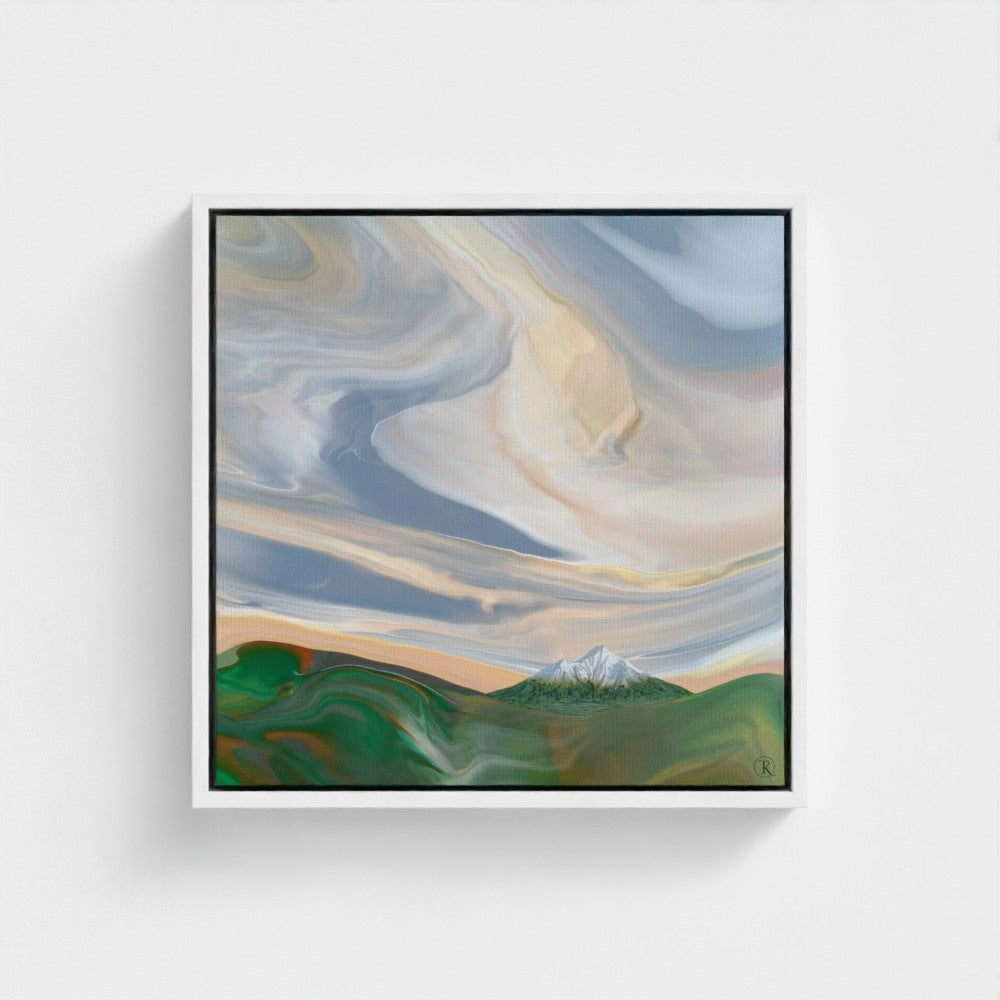 Framed abstract painting with a sweeping sky and a snow capped mountain on the horizon.